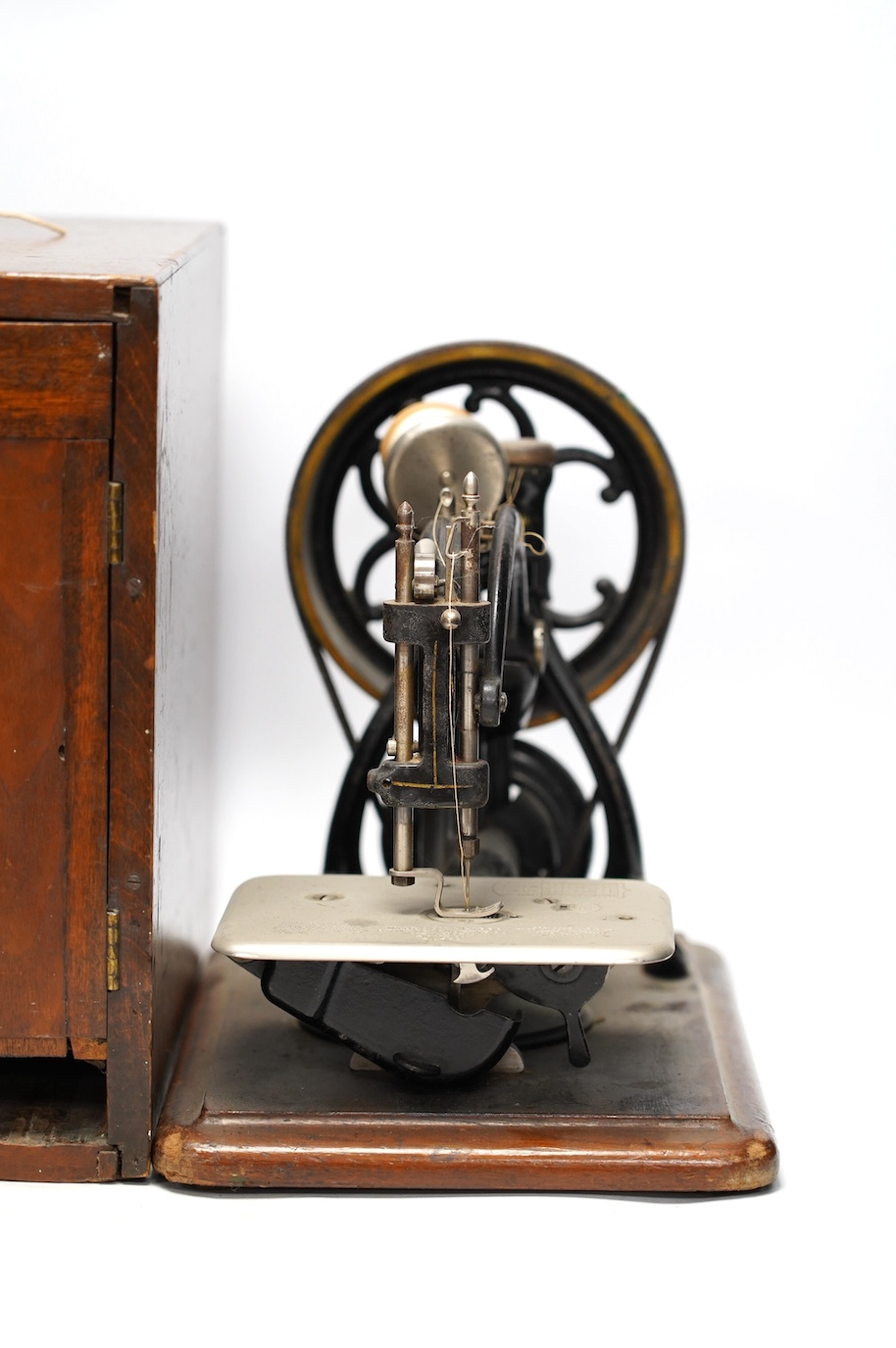 A late 19th/early 20th century Willcox & Gibbs swan neck sewing machine, with its original mahogany case, engraved brass owners label to top of case. Condition - fair to good